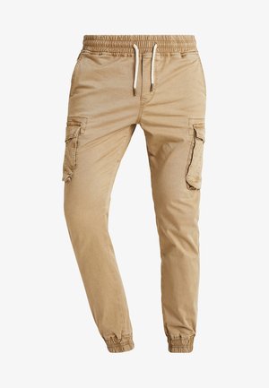 Khaki cargo bukser med elastisk talje, snøre og tætsiddende pasform. Har sidelommer og et glat, struktureret bomuldsstof.