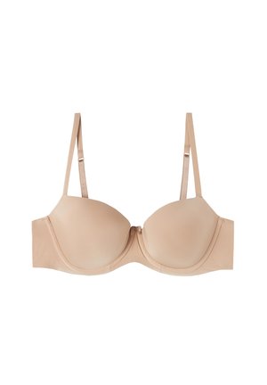 Beige voorgevormde bh met verstelbare bandjes. Glad fabric, ondersteuning met onderdraad en naadloze cups. Eenvoudig ontwerp zonder extra patronen of accenten.
