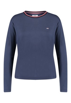 Laivastonsininen pitkähihainen paita pyöreällä pääntiellä, jossa punaiset, valkoiset ja siniset reunukset sekä pieni rinnassa vasemmalla puolella oleva logo.