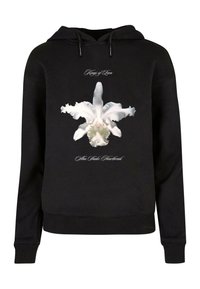 Svart hoodie med en vit orkidé-grafik i mitten och texten "Kings of Leon" ovanför, med ribbade ärm- och nederkanter.