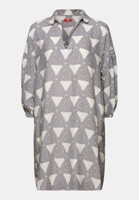 Robe ample noir et blanc avec manches trois-quarts et col ouvert, à motif de triangles répétés remplis de textures ponctuées.
