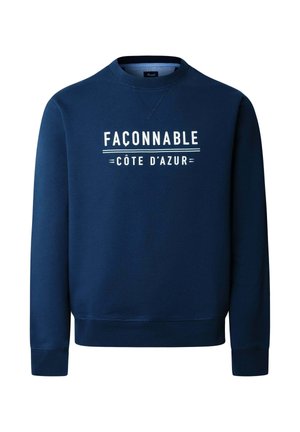 Marineblauwe crewneck-trui met witte tekst "FAÇONNABLE CÔTE D'AZUR" gecentreerd op de voorkant, met geribbelde manchetten en zoom.