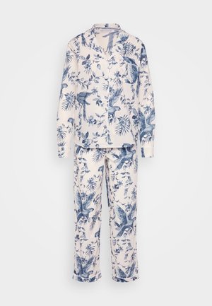 Cotton pajama set featuring a white background with blue floral and bird patterns, long sleeves, button-up shirt, and loose-fitting pants.