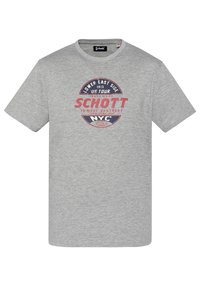 Camiseta de algodón gris de manga corta, que presenta un logotipo gráfico circular en rojo y azul en la parte frontal que incluye texto y el nombre de la marca.