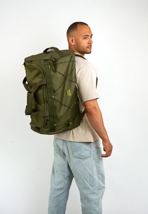 Green backpack with a textured finish, featuring adjustable straps, a zip closure, and yellow accents. Sturdy design suitable for travel.