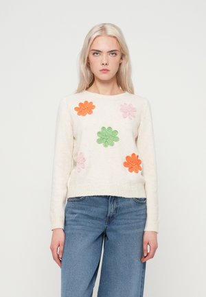 Pull en mélange de laine de couleur crème, orné de fleurs brodées vives en orange, rose et vert. Col et poignets côtelés, coupe décontractée.