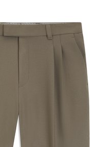 Close-up of khaki tailored trousers with belt loops, side pockets, and a flat front design.