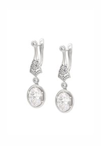 Orecchini a goccia in argento con cristalli ovali trasparenti, accentuati da cristalli tondi più piccoli e un design geometrico superiore. Finitura liscia e lucida.