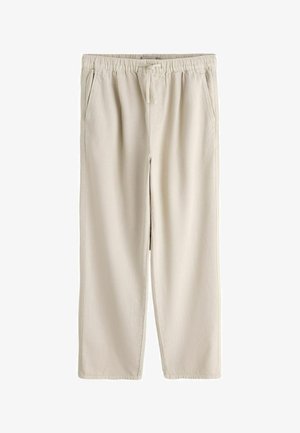 Light beige casual pants with elastic waistband and drawstring, straight legs, and side pockets, displayed on white background.