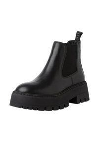 Botas Chelsea de cuero negro con un panel lateral elástico texturizado y suela de plataforma gruesa. Cuenta con una lengüeta para facilitar el calzado.