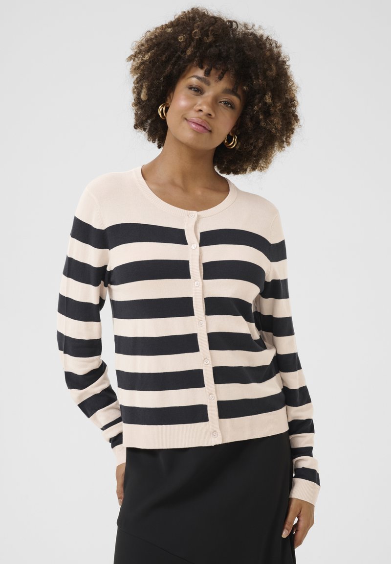 Striped cardigan featuring wide beige and navy stripes, soft fabric, round neckline, and button closure along the front.