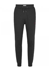 Svarta sweatpants i mjuk bomullsmix, med dragsnöre i midjan, smalnande ben och en liten röd logotypdetalj på vänster lår.