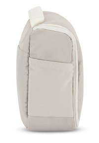 Pieni beige kangaspussi, jossa on teksturoitu pinta, sivutasku ja valkoinen vetoketju. Pyöristetyt kulmat parantavat kompaktiutta.