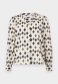 Long-sleeve blouse in cream with black diamond pattern, featuring a button-down front and a round neckline. Soft, lightweight fabric.
