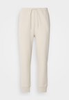 HADIKO - Donji dijelovi trenirke - light beige