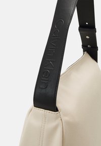 Calvin Klein GRACIE - Shopper - dark ecru