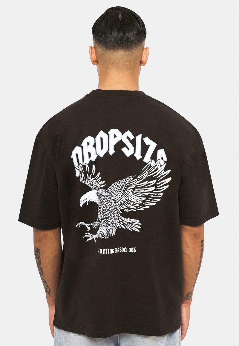 Black cotton t-shirt featuring a large white eagle graphic on the back, with the text "DROPSIZE" and "HUNTING SEASON 365" below it.