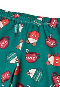 Zelené látkové šortky s opakujícím se motivem červených a tyrkysových hrnků, šlehačky a cukrových třtin. Elastický pas s bílým prošitím.