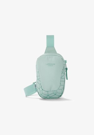 Miętowozielona saszetka wykonana z miękkiego materiału z geometrycznym wzorem. Posiada górną pętelkę oraz zamek błyskawiczny, zapewniający bezpieczne przechowywanie.