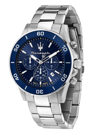 Stainless steel chronograph watch with a blue bezel and dial, silver accents, three sub-dials, and date display at the six o'clock position.
