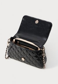Quilted black handbag with a shiny finish, gold hardware, and a chain strap. Opened to reveal a pale interior with multiple compartments.