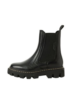 Bottine Chelsea en cuir noir avec semelle épaisse à crampons, côtés élastiques et languette à l'arrière pour un enfilage facile.
