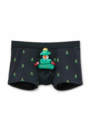 Calzoncillos boxer negros con patrón de árboles de Navidad verdes; cuentan con un pingüino de peluche vestido como un árbol de Navidad en la parte delantera.