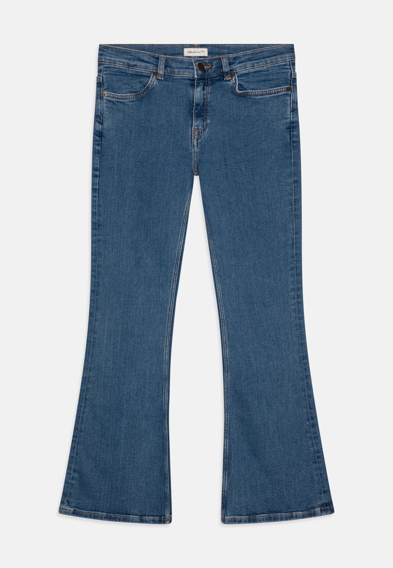 Lyseblå utsvingte jeans laget av denim. Har et klassisk fem-lommers design, frontlukking med knapp, og subtile sømdetaljer.