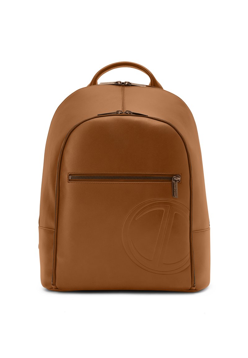 Brown leather backpack with a smooth texture, rounded shape, a front zippered pocket, and embossed logo detail on the side.