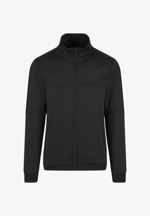 Chaqueta negra con cremallera hecha de un tejido suave, que presenta un cuello alto, costuras frontales y un detalle de logo en la parte superior izquierda. Textura suave, diseño ajustado.