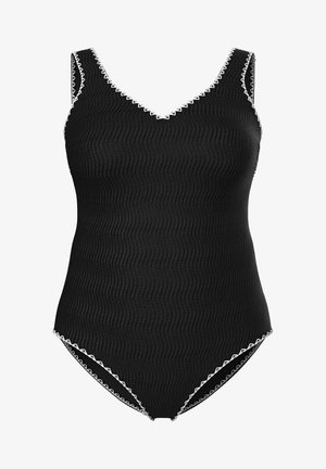 Schwarzer, strukturierter Einteiler mit V-Ausschnitt und weißem Zickzackbesatz entlang der Kanten und Armlöcher.