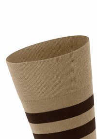 Beige Sock mit horizontalen dunkelbraunen Streifen, aus strukturiertem Stoff gefertigt, mit einem gerippten oberen Rand für einen sicheren Sitz.