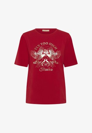 Crvena pamučna majica s grafičkim otisakom dviju ptica i dekorativnim elementima u bijeloj i zlatnoj boji. Okrugli izrez i kratki rukavi.