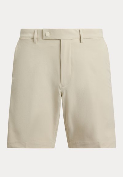 Μπεζ σορτς από απαλό ύφασμα, με επίπεδη μπροστινή όψη, κλείσιμο με κουμπί και πλαϊνές τσέπες. Σχεδιασμός με ίσιο πόδι χωρίς εμφανή σχέδια.