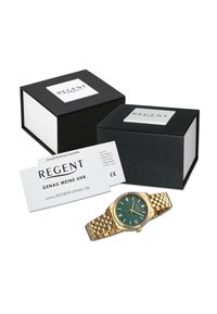 Montre dorée avec un cadran texturé vert, fonction date et bracelet en maillons. Deux boîtes noires avec le logo "REGENT" et carte de garantie.