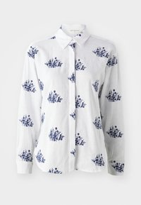 White linen shirt featuring a blue floral print, button-up front, and a classic collar with long sleeves and cuffed wrists.