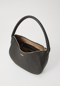Black leather handbag with a textured surface, gold zipper, and a curved handle. Interior features a brown fabric lining and a zipper pocket.