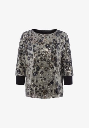 Shiny, short-sleeve top with silver and black sequin leopard pattern, round neckline, and black ribbed cuffs. Textured fabric with shimmering accents.