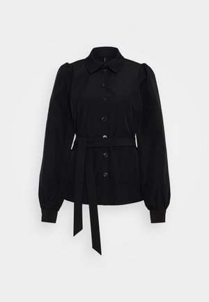 Black button-up shirt with a collar, puffed sleeves, and a tied waist. Features two front pockets and a smooth texture.