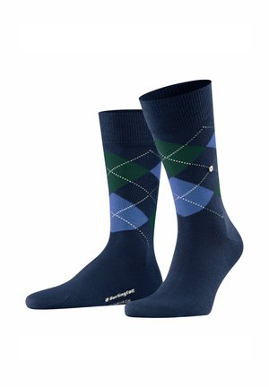 Navy blue socks with green and blue argyle pattern and white stitching detail, branded "Burlington" on the sole.