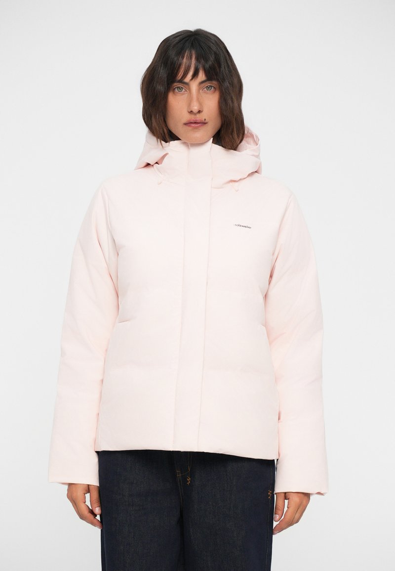 Padded pink jacket with a hood, front zip closure, and side pockets. The fabric has a smooth texture with a logo on the upper left chest.