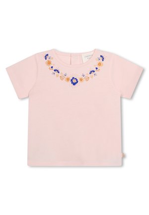 T-shirt en coton rose à manches courtes avec des broderies florales bleues et oranges autour du col, dotée d'un col arrondi et d'une étiquette à l'arrière.