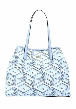 Lichtblauwe tote tas met geometrisch patroon en twee lange hengsels, met het "Guess" logo in gouden letters aan de voorkant.
