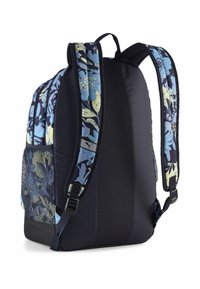 Rucksack mit gepolstertem schwarzen Rückenteil, blauen und gelben blumengemusterten Trägern, seitlichem Netzfach und Traggriff an der Oberseite.