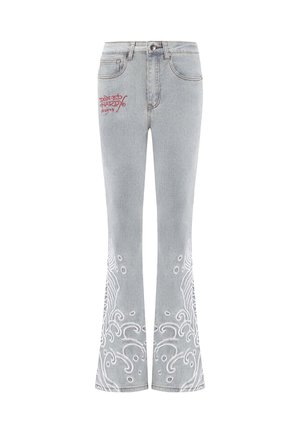 Light gray flared jeans with white embroidered wave patterns at the hems. Features a button and zipper closure; "Ed Hardy" logo in red.