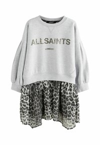 Hallide särk, millel on "ALL SAINTS LONDON" prinditud kamuflaažiga. Tootel on ruffled leopardimustriga seelik, mis on valmistatud läbipaistvast kangast, ja pikad puffitatud varrukad.