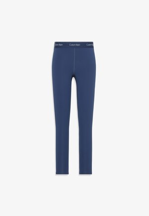 Marineblauwe leggings van rekbaar materiaal, met een gladde textuur en een elastische tailleband met het Calvin Klein-logo erop gedrukt.