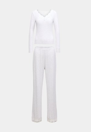 Σετ λευκής άνετης ένδυσης με μακρυμάνικη μπλούζα με λαιμόκοψη με κυματιστό τελείωμα και παντελόνι που ταιριάζει, με δαντέλα στο τελείωμα. Μαλακή υφή.