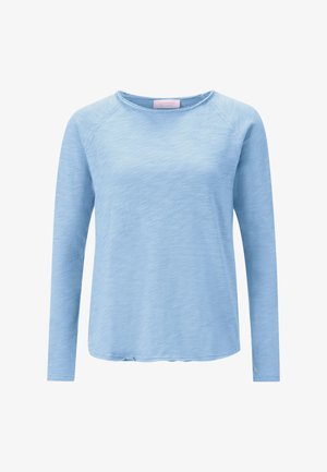 Hele sinine pikkade varrukatega särk, valmistatud pehmest ja tekstureeritud kangast. Omadusteks on ümmargune kaelus ning lõdvestunud lõige õmblustega õlgadel.