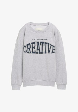 Gray sweatshirt featuring a round neck, ribbed cuffs, and bold text "CREATIVE" in navy blue, with the phrase "IT IS A GOOD DAY TO BE" above.